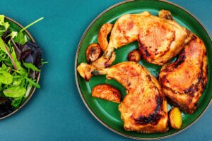 Grilled chicken meat on the plate. Cooked roasted chicken legs