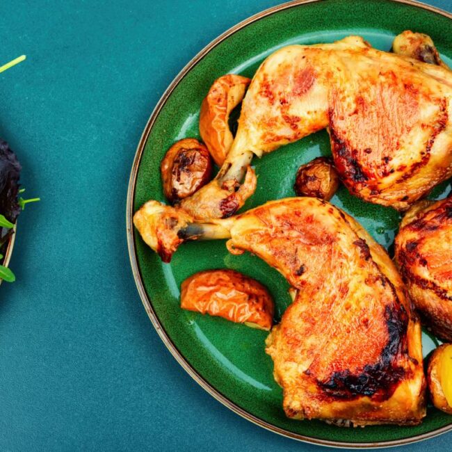 Grilled chicken meat on the plate. Cooked roasted chicken legs