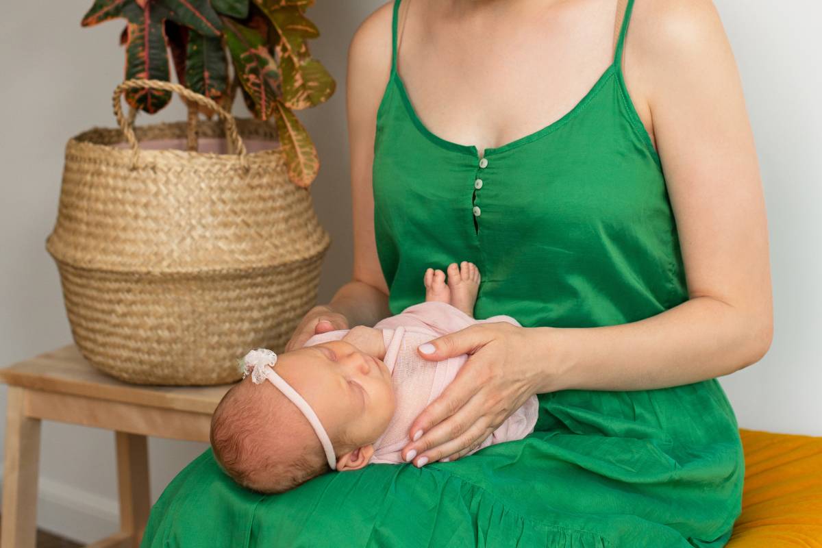 mom holds the hand of a newborn baby. Love and tenderness. Mothers Day. Copy space